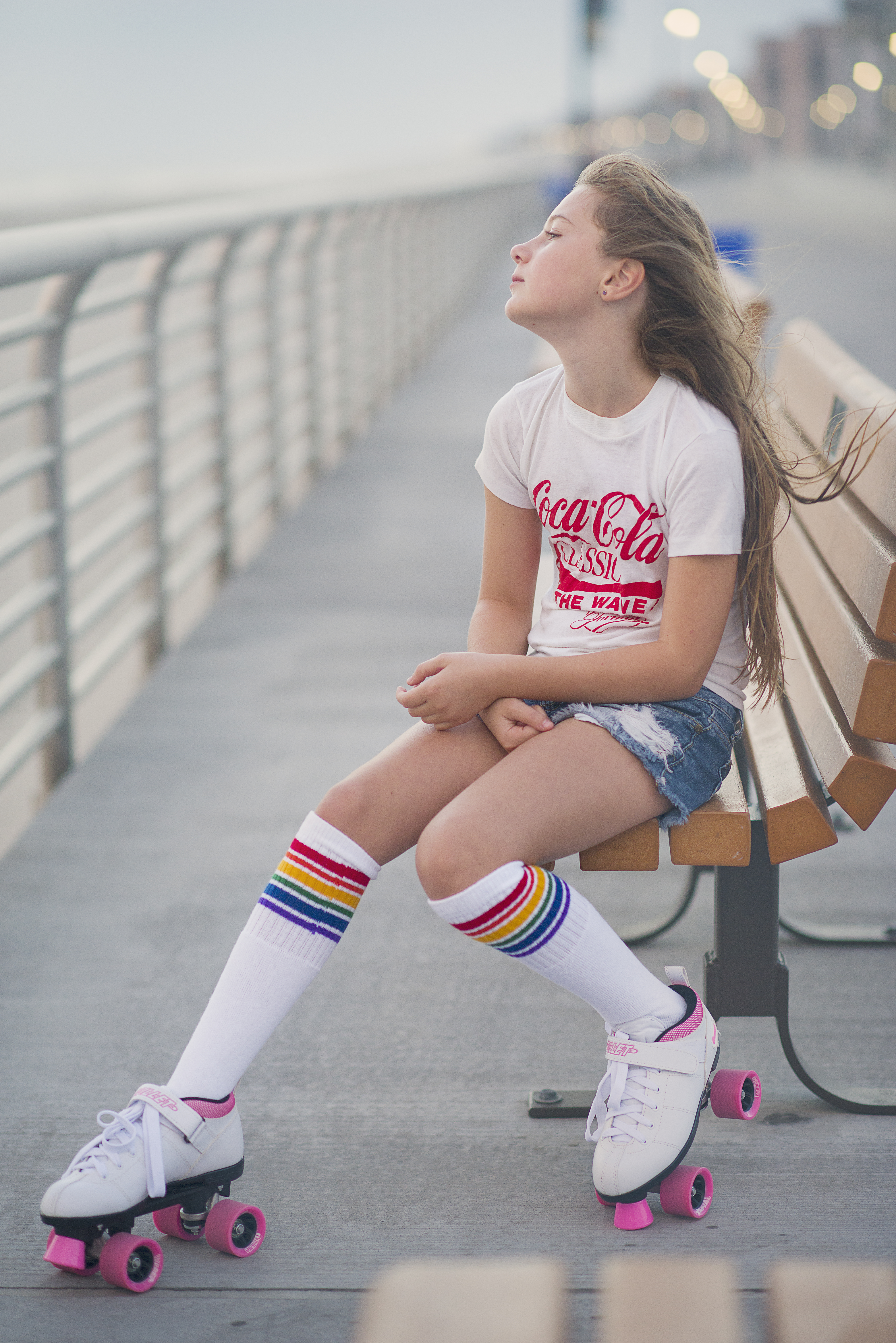 retro ten year old girl on roller skates on Long Beach Boardwalk