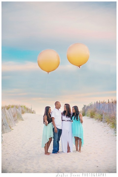 Family with whimsical balloons at Nickerson Beach