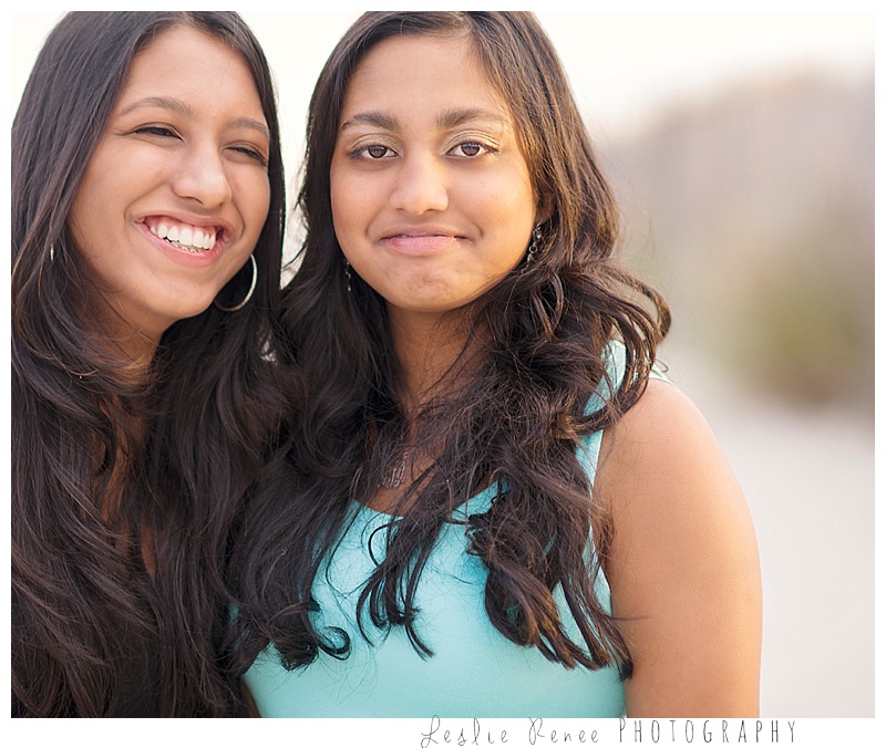 Oceanside sisters laughing at Nickerson Beach