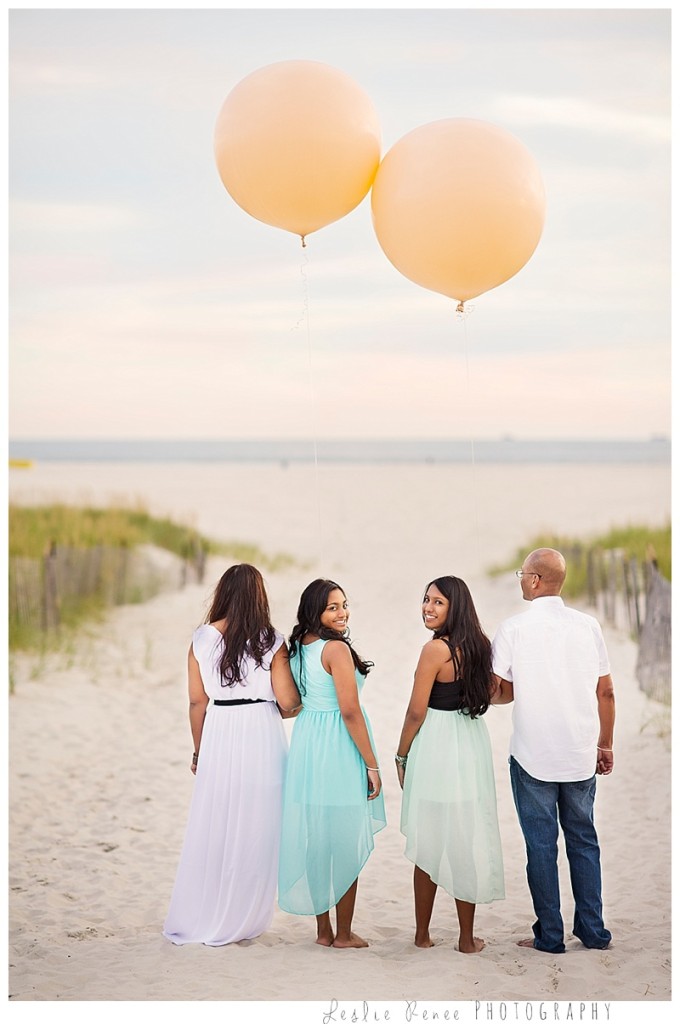 Oceanside Family at the beach with giant balloons