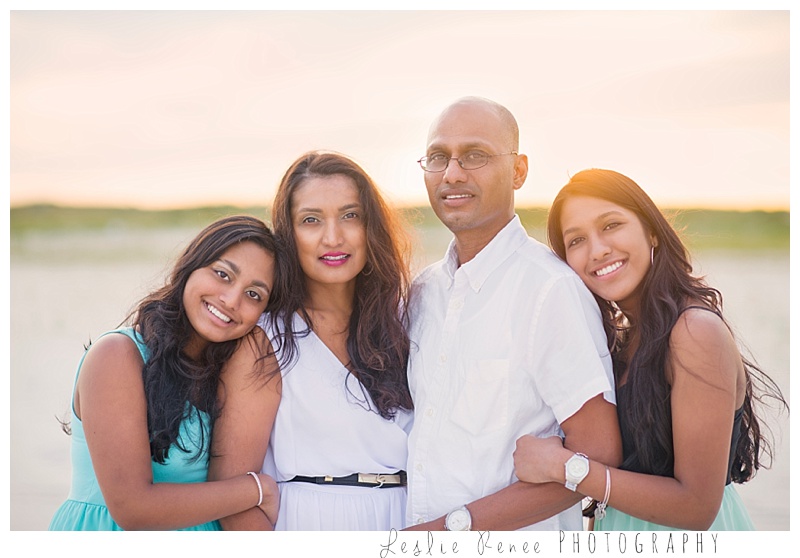 Oceanside parents with twins on the beach