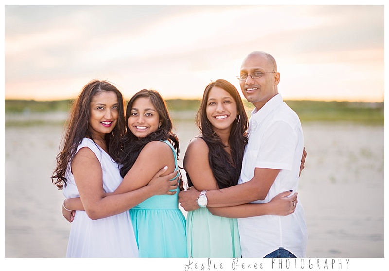 Oceanside family hugs at Nickerson Beach