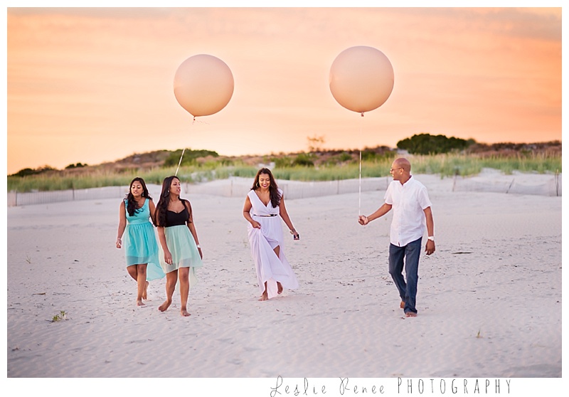 Oceanside family at Nickerson beach with giant balloons