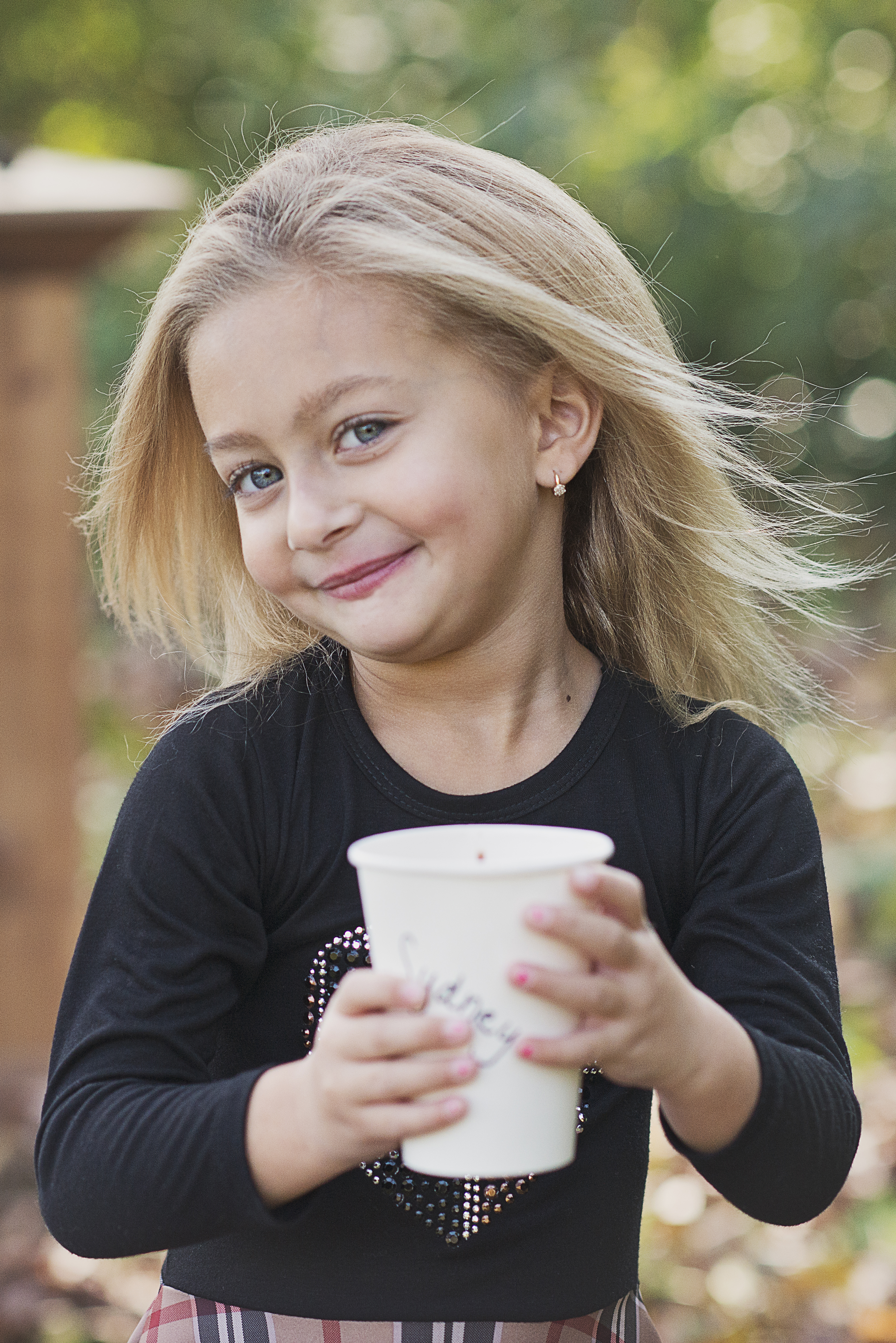 Oceanside little girl with hot chocolate at Silver Lake Park