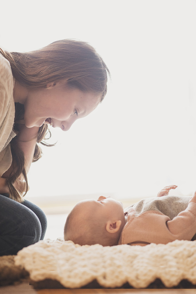 oceanside big sister with baby sister in home session