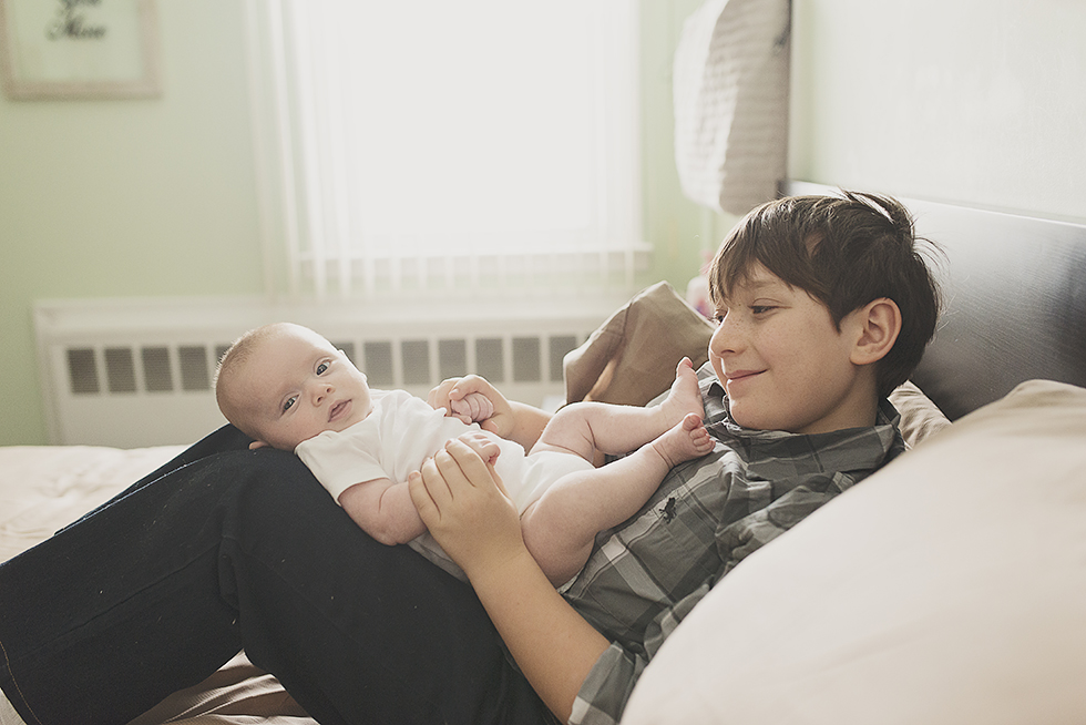 newborn on a bed photos