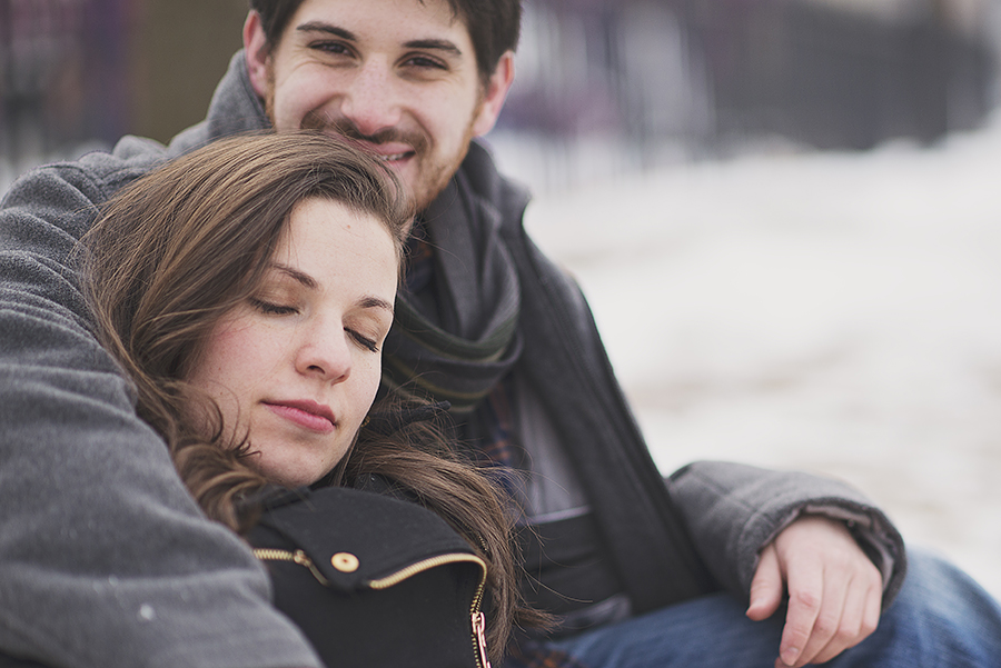 cuddling couple at Astoria Park