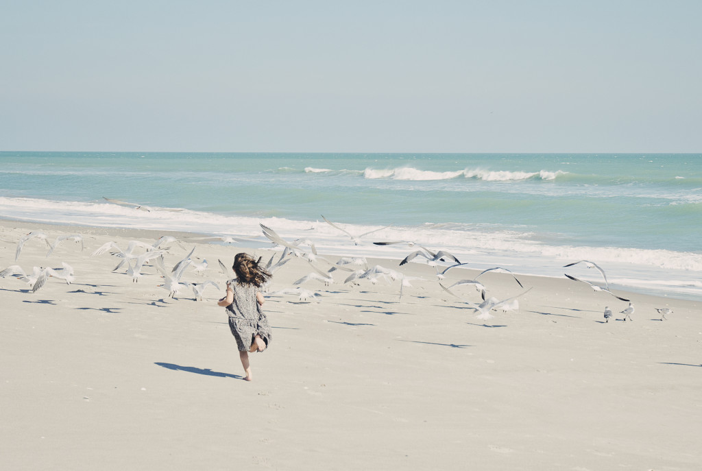 4 year old running on the beach