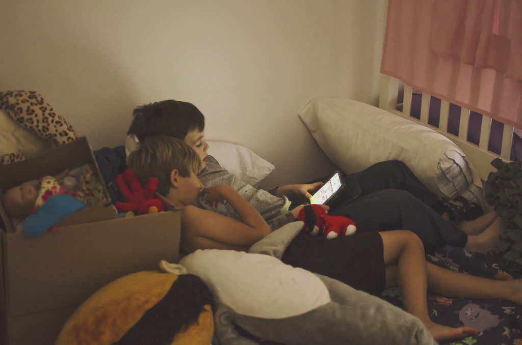 cousins playing on ipad