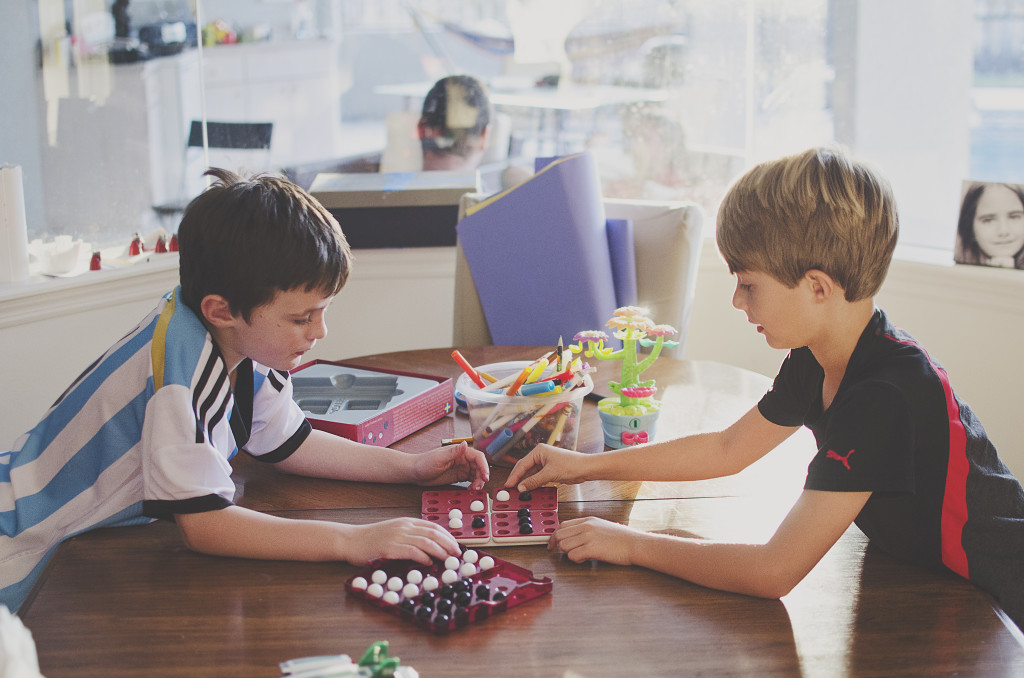 boys playing pentago