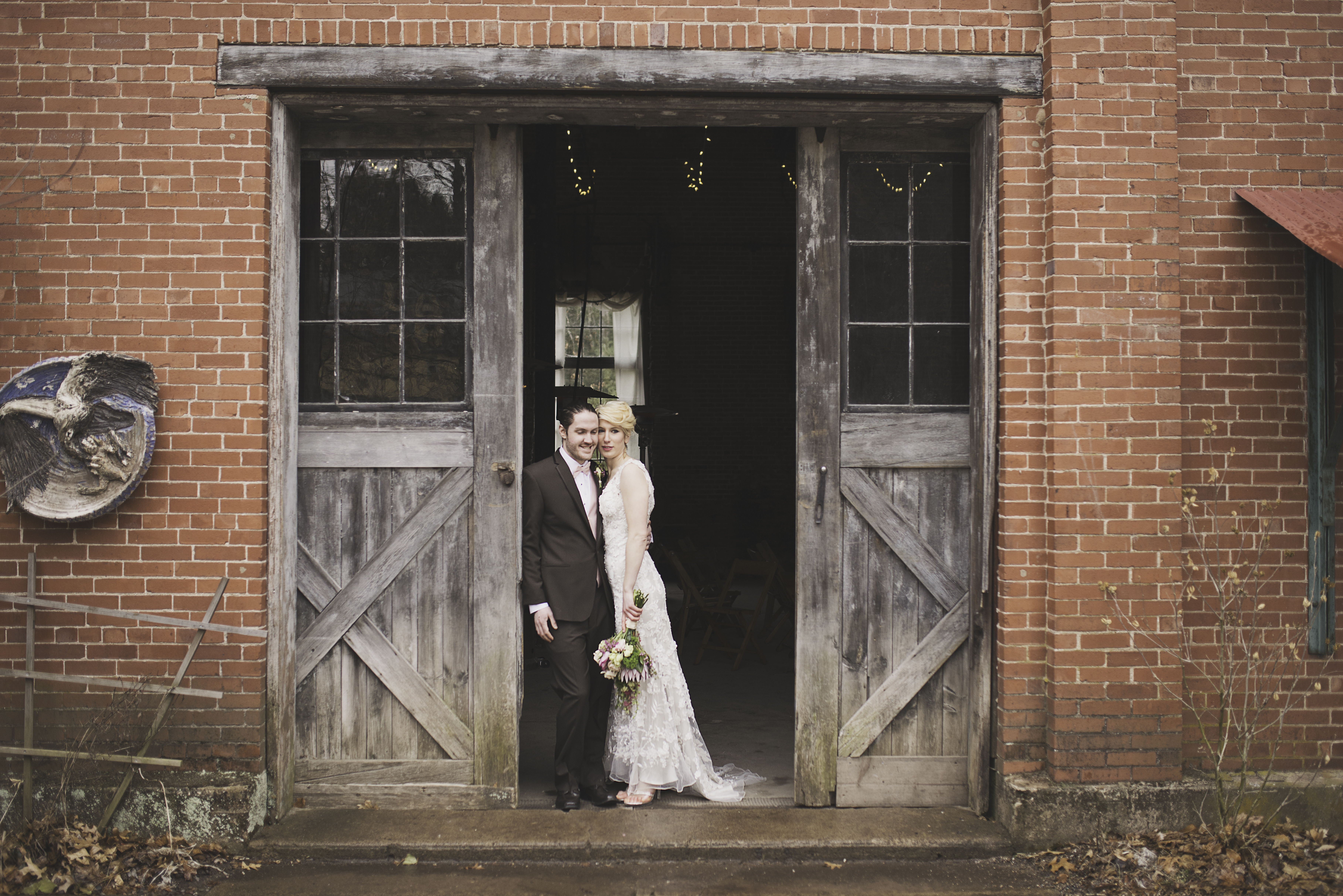 rustic barn door wedding couple