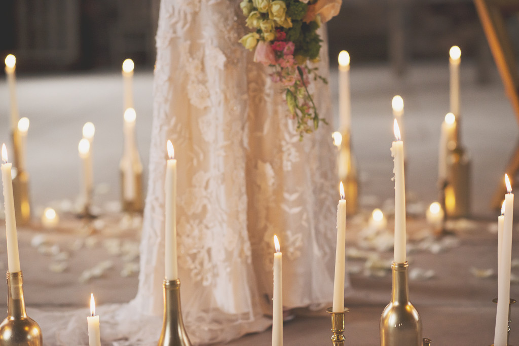 red brick barn wedding dress and candles