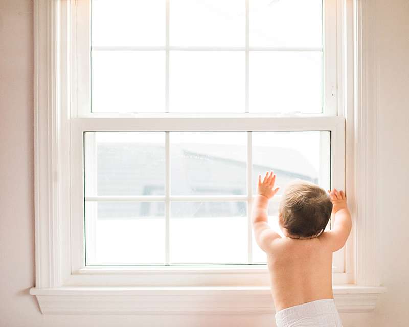 Long Beach Baby Photographer baby exploring the world through her window