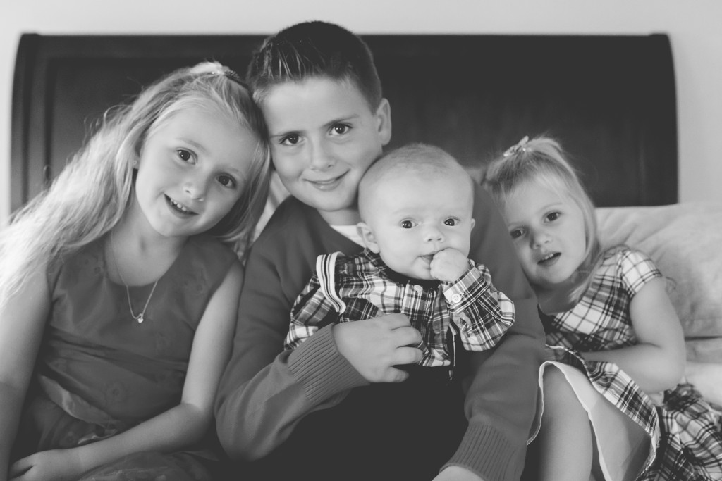 brother and sisters on the bed