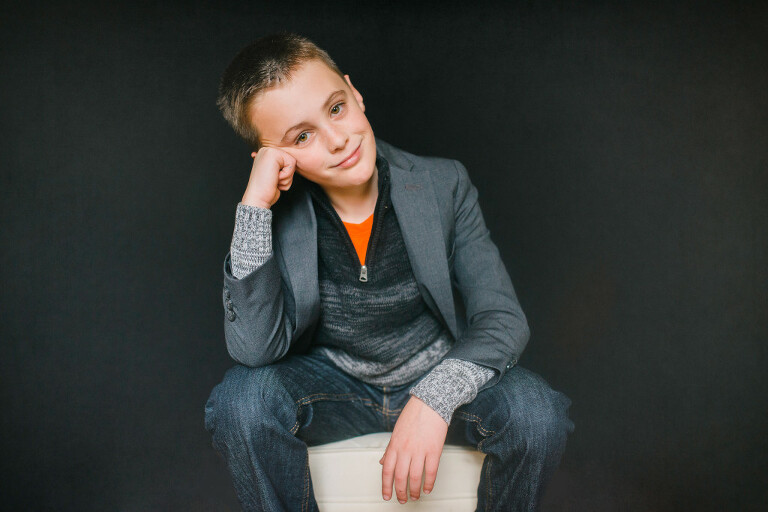 nine year old boy in super model pose