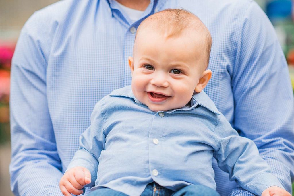 Smiling baby in daddy's arms