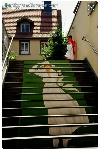 women painted onto stairs tromp l'oil style