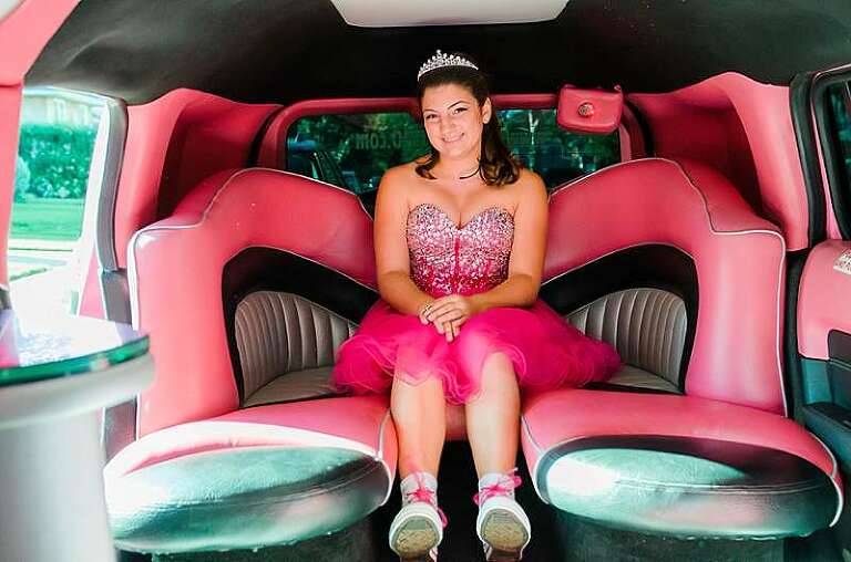 Bat mitzvah girl in pink limo 