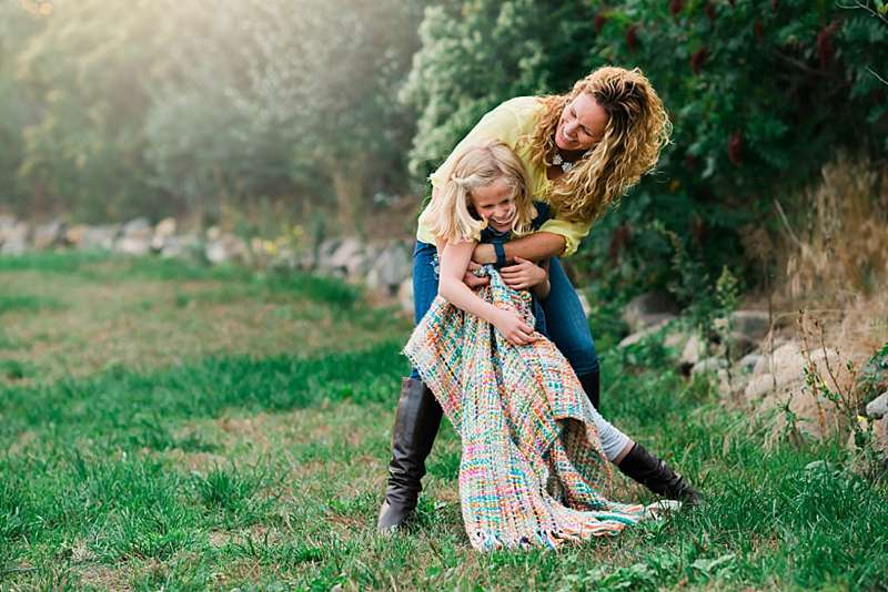 playful mom and daughter photo