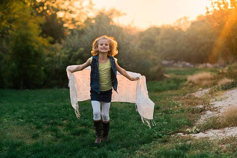 little girl frolicking in the sunlight