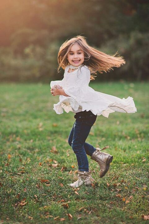 Rockville Centre Family Photographer spinning girl