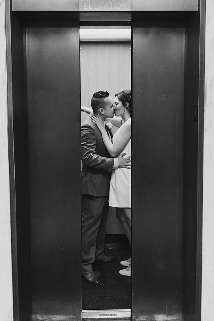 Long Island Town Hall Wedding couple in an elevator