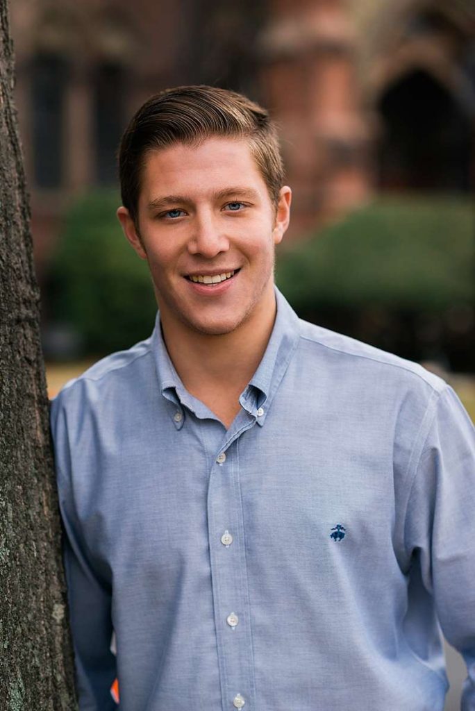 Huntington Family Photographer against a tree