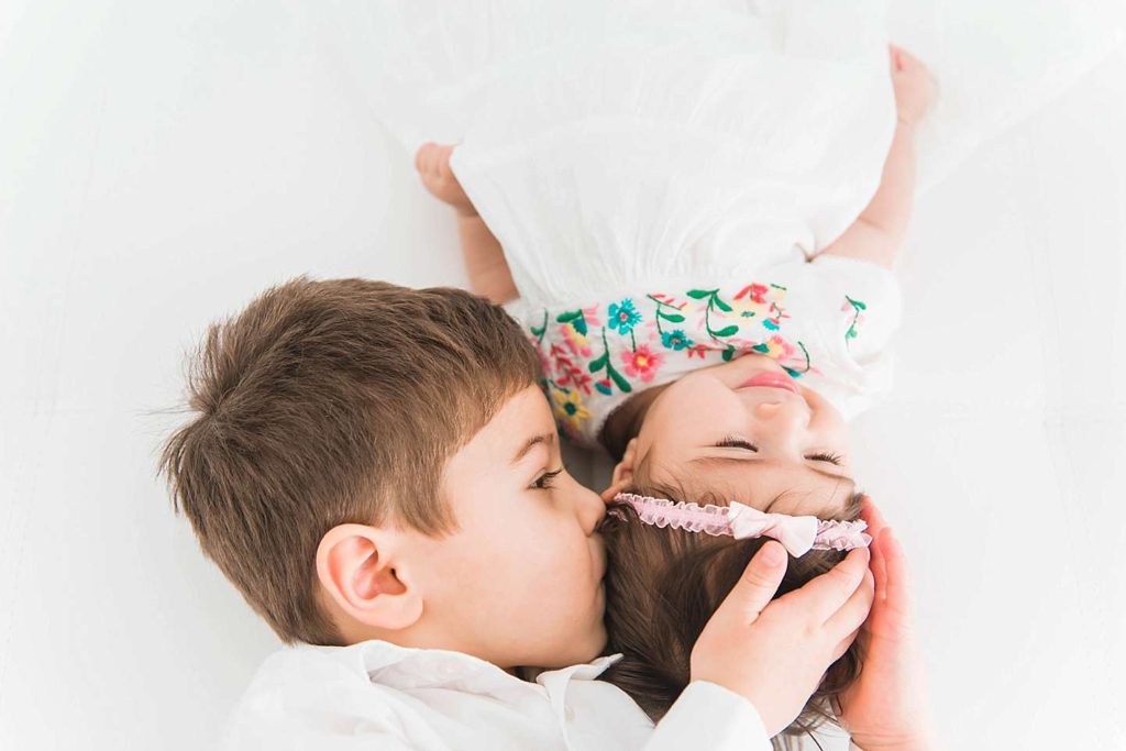 Long Island Child Photographer big brother kisses little sister