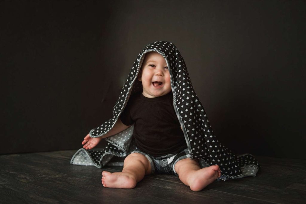 Long Island Baby Photographer smiling baby with blanket