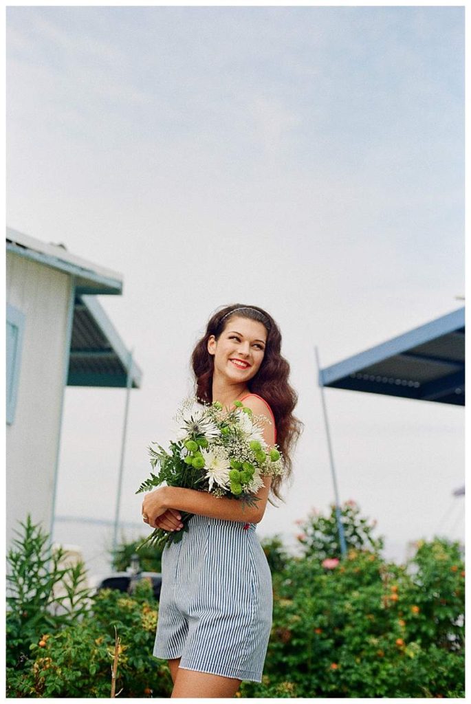 Long Island Film Beach Engagement retro girl with flowers