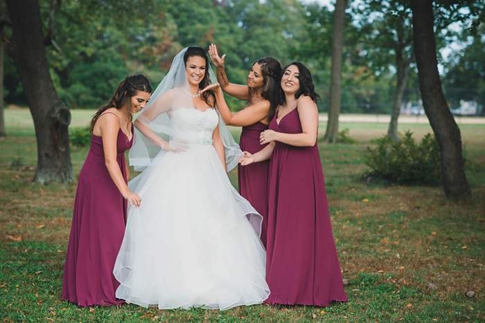 Fun Long Island Wedding Photographer bride's maids make over bride