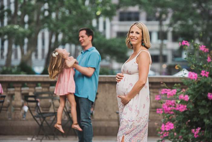 Bryant Park Family Maternity Photos focus on mom and baby bump