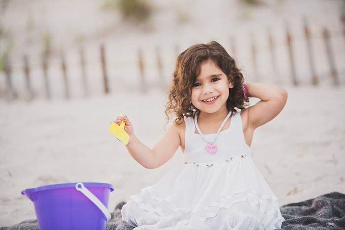 Lynbrook Family Photos playing in the sand