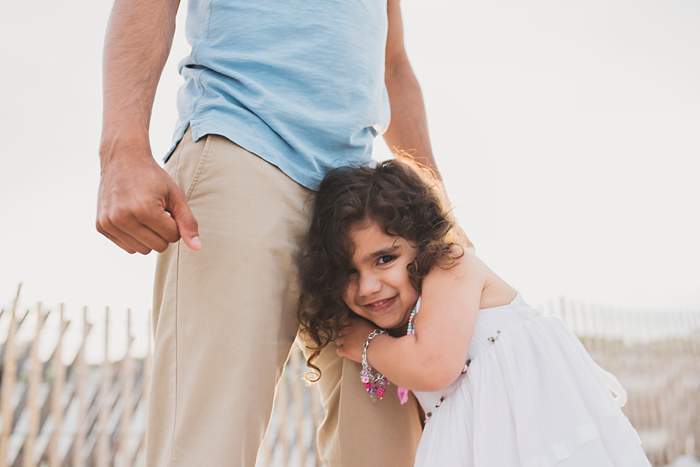 Lynbrook Family Photos hugging dad's leg