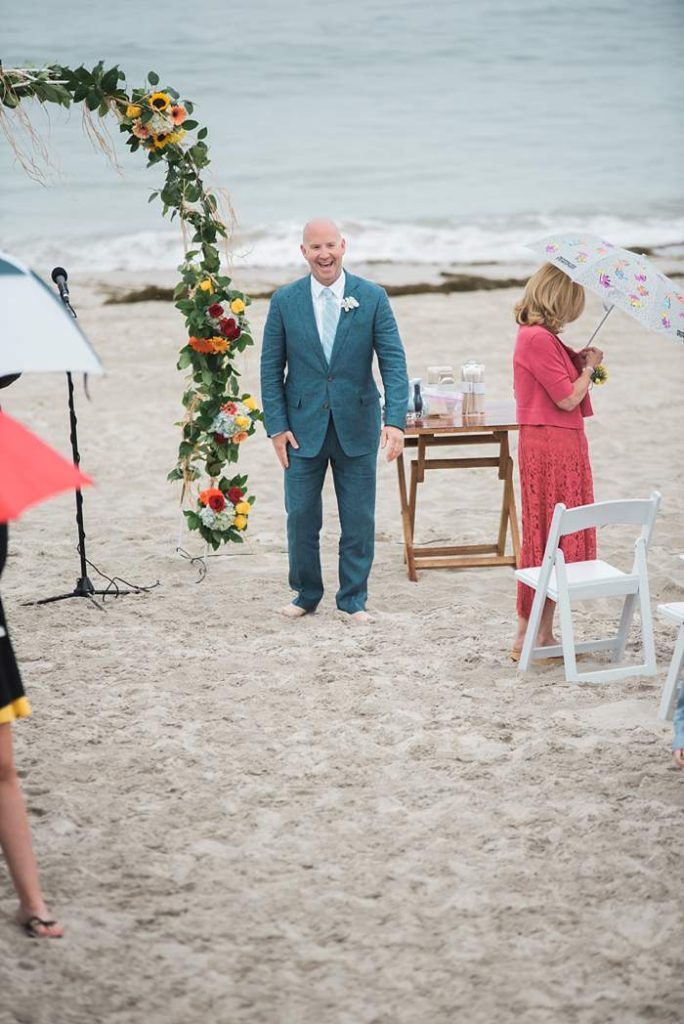 Long Beach NY Beach Wedding groom when he sees the bride