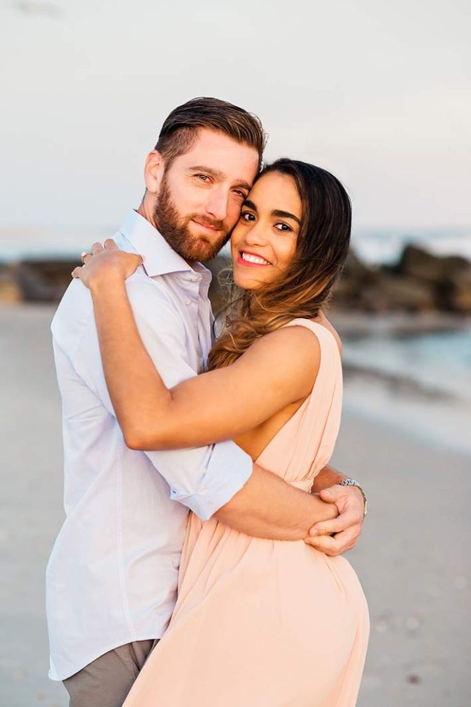 Long Island Beach Wedding Photographer couple embrace and smiles