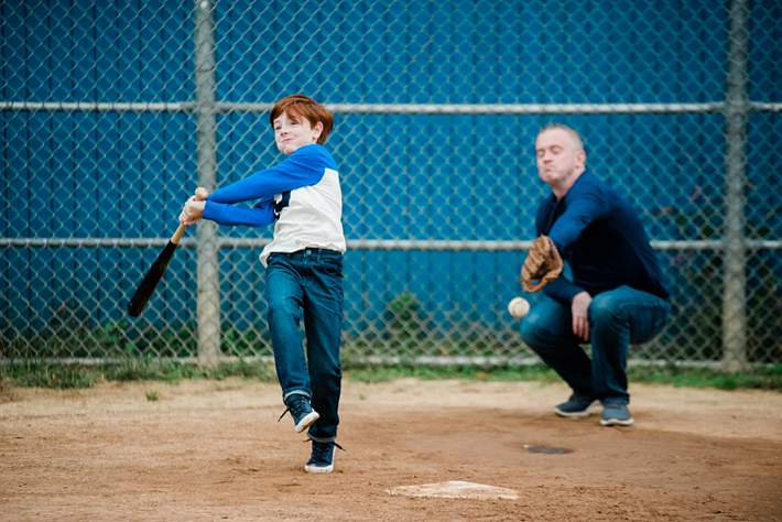 Long Island themed Family Photographer dad and son playing baseball