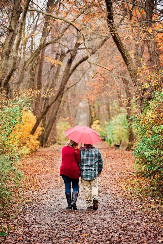 Long Island Engagement Photography walking in gardiner park with red umbrella