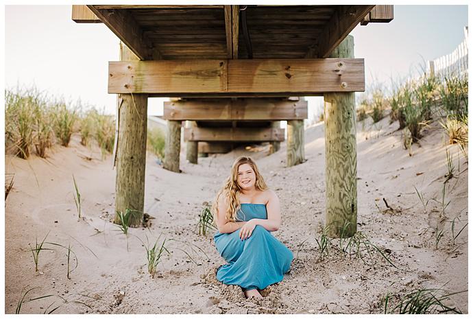 High school Senior Beach Session Long Island under the boardwalk 