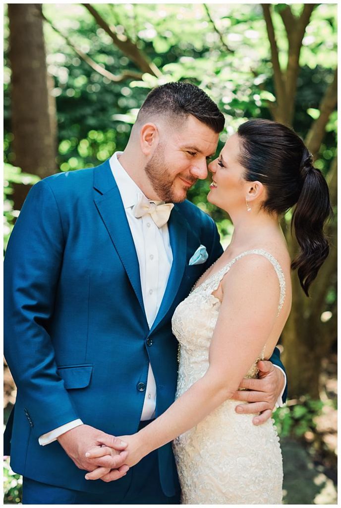 Garden City Hotel Wedding Photos bride and groom snuggle