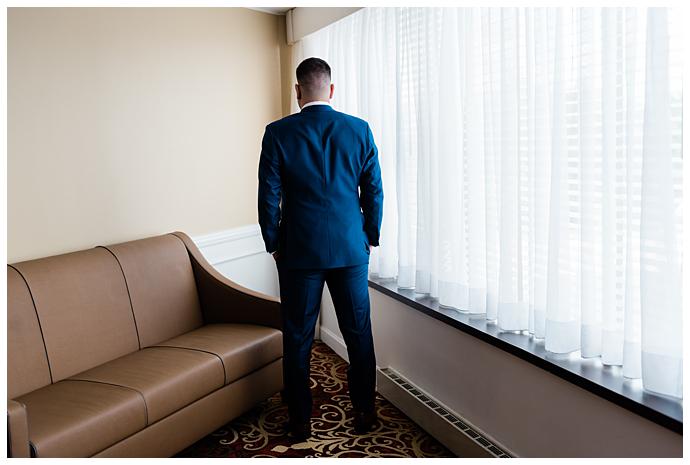 Garden City Hotel Wedding Photos groom waits for the bride