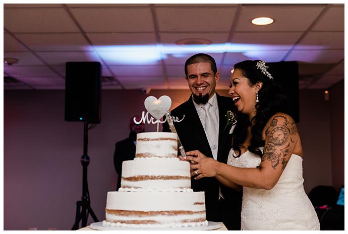 Waterview Wedding Long Island cutting the cake