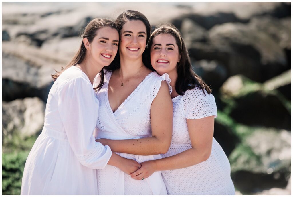 Adult Family Beach Photos sister snuggle pose