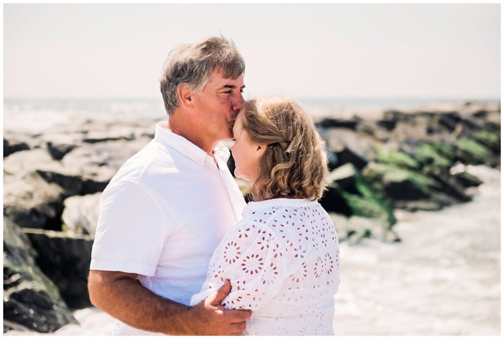 Adult Family Beach Photos dad and mom kiss