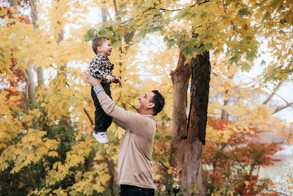 Massapequa Preserve Family Photos dad throwing baby