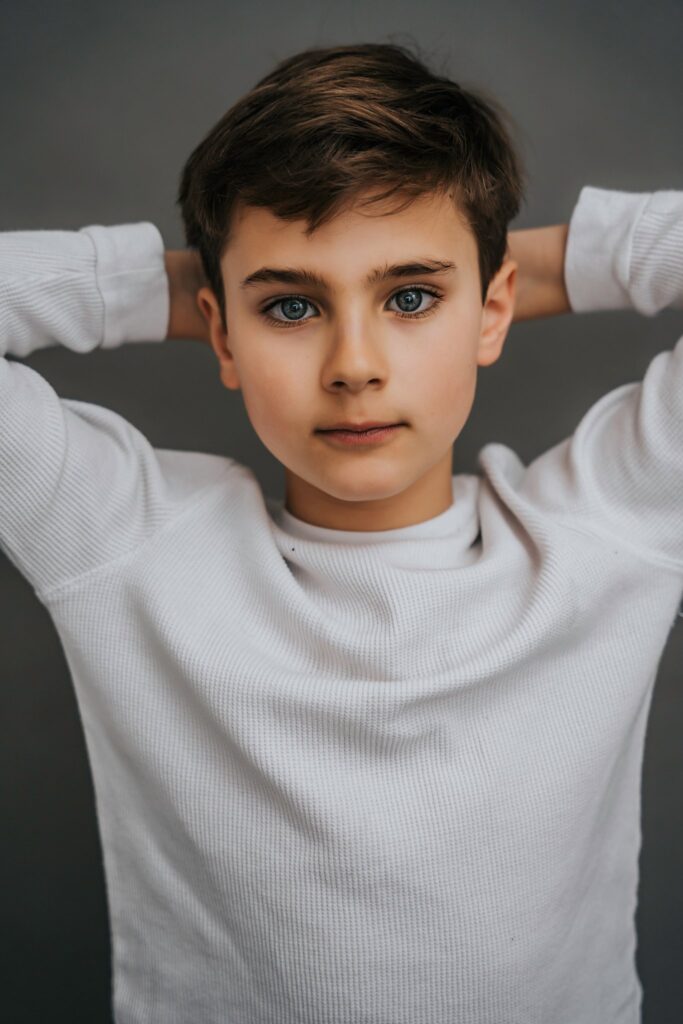 Child Actor Head Shots Long Island hands behind head