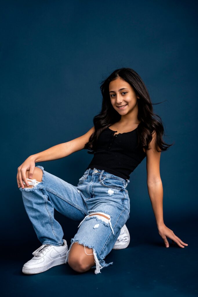 Teen Head Shots with Personality Long Island NYC blue backdrop