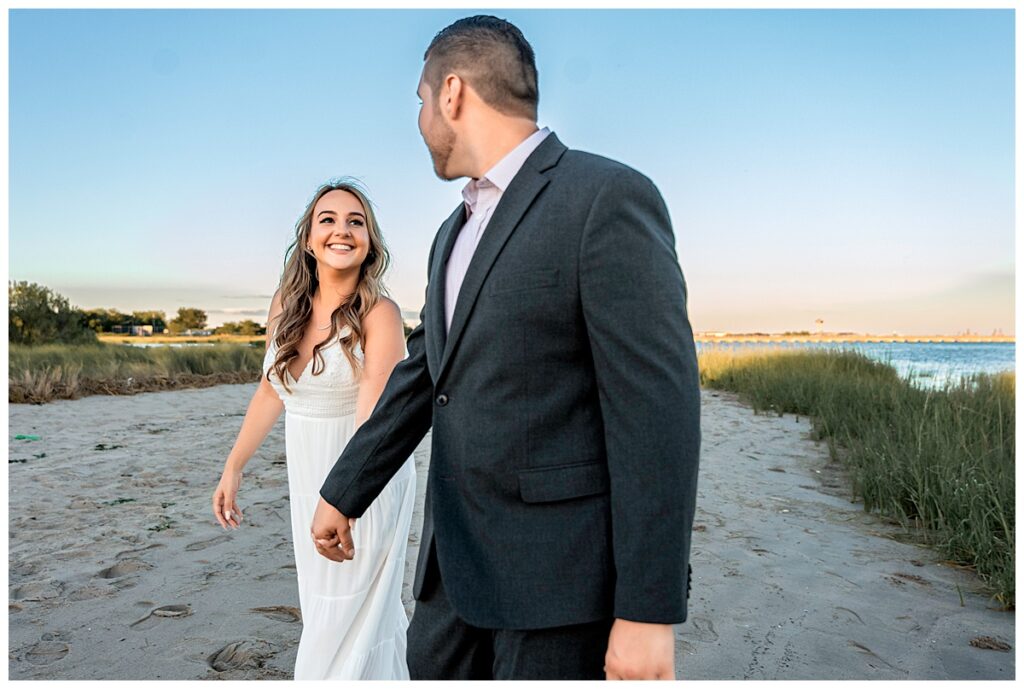 Howard beach couple beach engagement photos holding hands