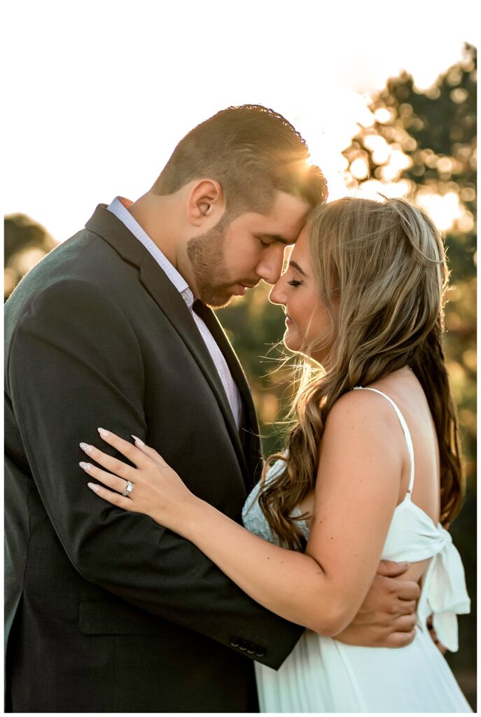 Howard beach couple beach engagement photos forehead to forehead