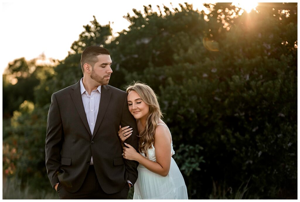 Howard beach couple beach engagement photos cuddle